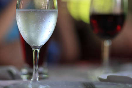 The glass of mineral water at a restaurantの写真素材