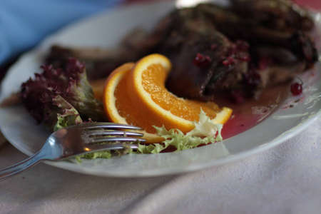 Roast duck with orange at a restaurantの写真素材