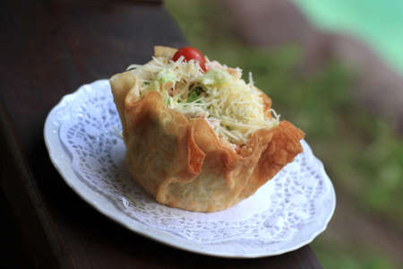 The salad in edible cover at restaurantの写真素材