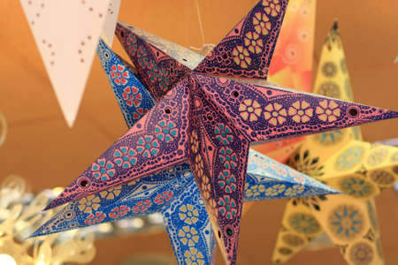The paper star suspended to a ceiling in a shopの写真素材