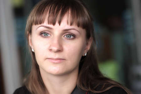 Portrait of thoughtful young woman at cafe