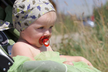 The baby knits his brows in a perambulatorの写真素材