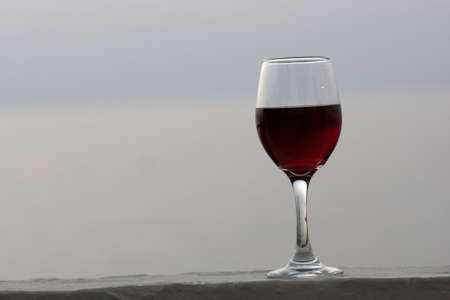 These is glass of wine outdoor in the eveningの写真素材