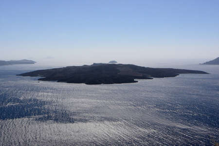 Island at Mediterranean Sea, view from Santoriniの写真素材