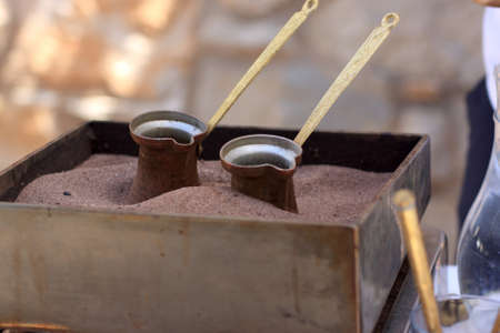 Preparation of greek coffee in the sandの写真素材