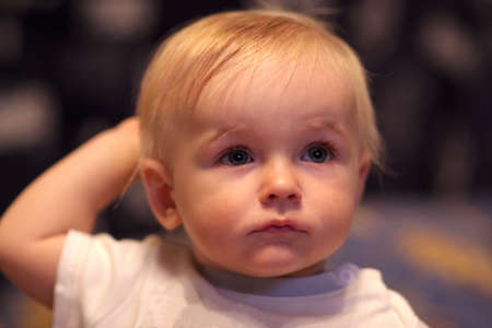Portrait of the serious baby at home