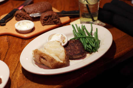 It is filet mignon with potato and pea podsの写真素材