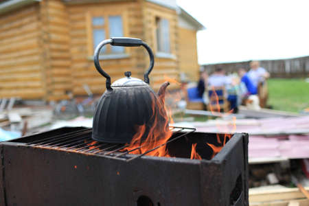 The smoky kettle in fire on weekendの写真素材