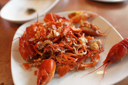 The boiled crayfishs on the plate in the restaurantの写真素材