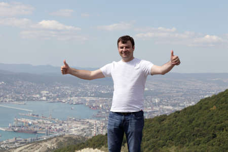 Happy man posing on Novorossiysk background, Russia