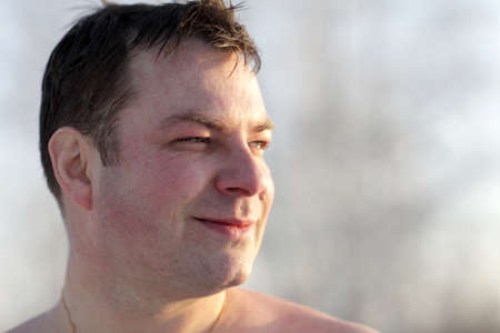 The happy winter swimmer posing after swimming, Siberiaの写真素材