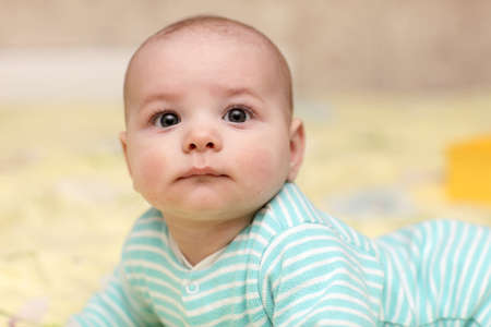 Portrait of funny baby boy at home