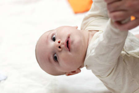 It is gymnastics for baby at homeの写真素材