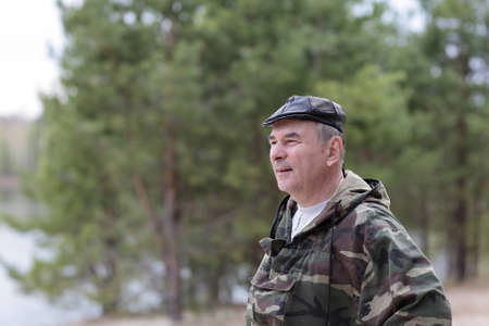 Portrait of mature man in summer parkの写真素材