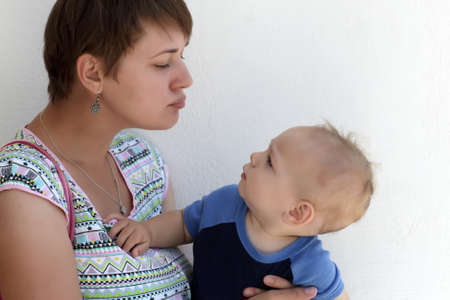 Mother and son on the wall background