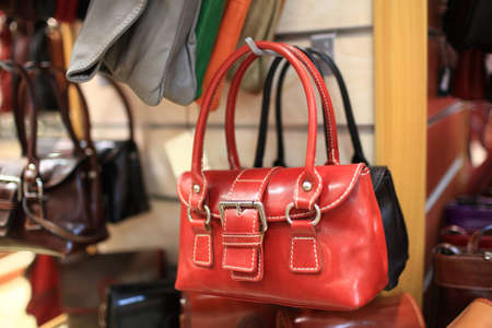 Red leather handbag in a department store