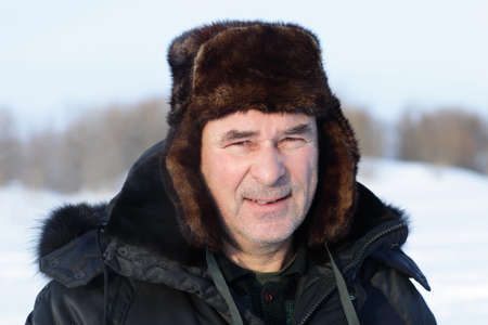 Face of calm senior man in winterの写真素材