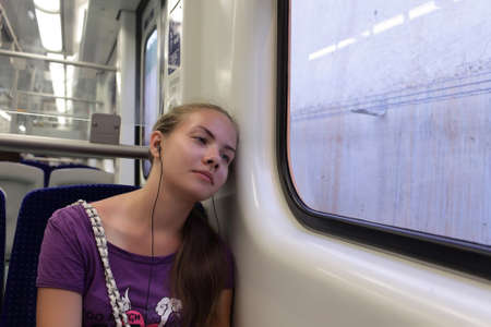 Girl is resting in subway train, Athens, Greeceの写真素材
