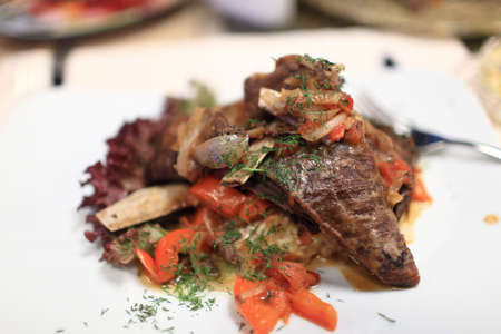 Lamb ribs with vegetables on a plate in the restaurantの写真素材