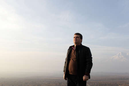 Man is posing on Ararat mount background, Armenia