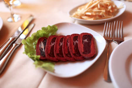 Sliced basturma on a white plate in an armenian restaurantの写真素材