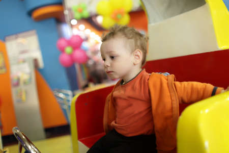 Portrait of pensive child at indoor playgroundの写真素材