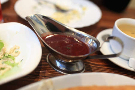 Tkemali sauce on a table in the georgian restaurant