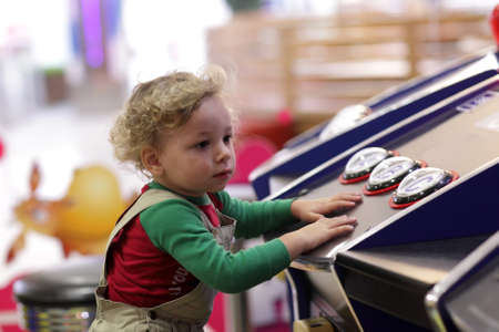 The child playing in the amusement parkの写真素材