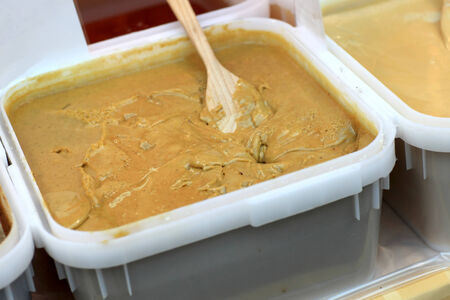 Brown honey in a box at the marketの写真素材