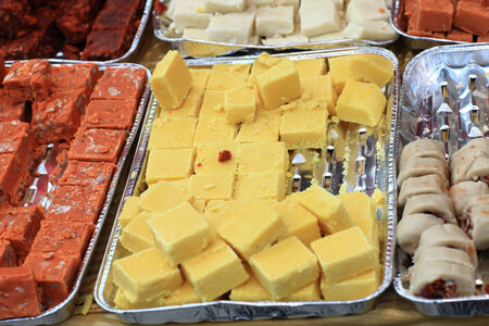 The indian sweets for sale at a marketの写真素材