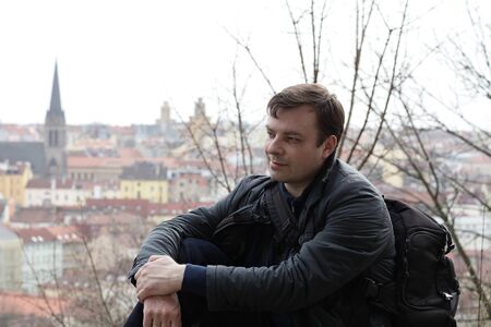 Tourist posing on a Prague background at Vitkov hillの写真素材