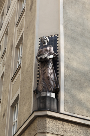 Sculpture of woman on corner of the building in Pragueの写真素材