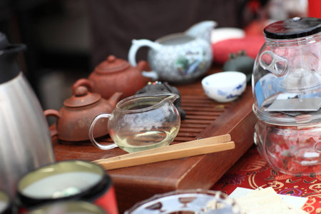 Tea set on a wooden plate at the marketの写真素材