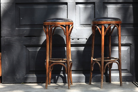 Two vintage wooden bar stools in the pubの写真素材