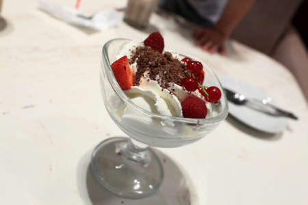 Ice cream with fruits on the plateの写真素材