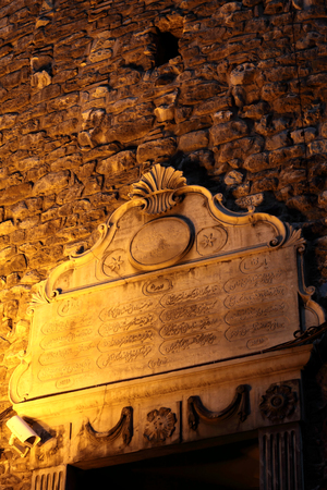 Arabic inscription over the doorway of Galata Tower at night, Istanbulの写真素材