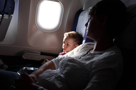Portrait of family on board the aircraftの写真素材