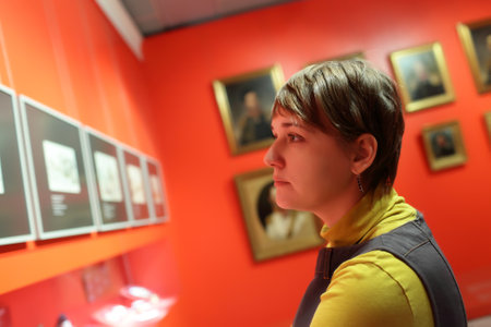 Tourist looking at a picture at the exhibitionのeditorial素材