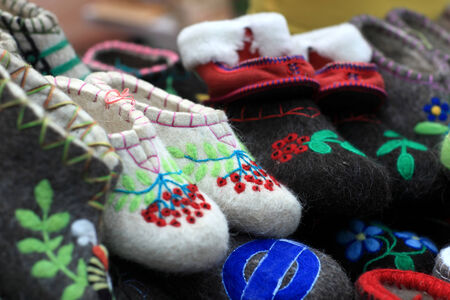 Various felt slippers on the market counterの写真素材