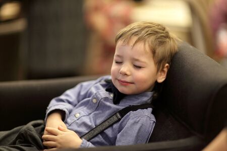 Portrait of a child on the sofaの写真素材