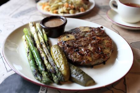 Grilled cutlet with vegetables on a plate