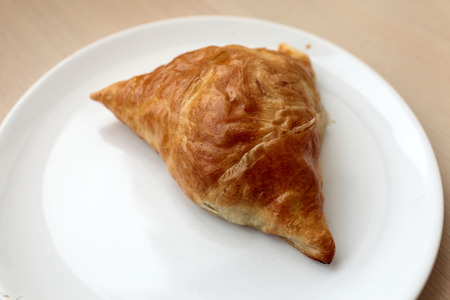 The homemade samsa on a white plateの写真素材