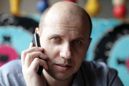 Portrait of a serious man with mobile phone