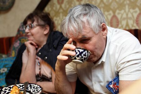 Senior couple has dinner in the asian restaurantの写真素材