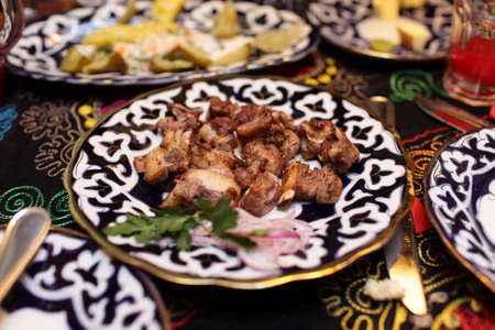 Grilled lamb chops on a plate in the restaurantの写真素材