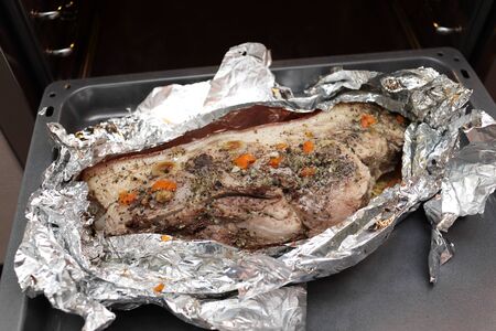 Cooking of pork shoulder in the foilの写真素材