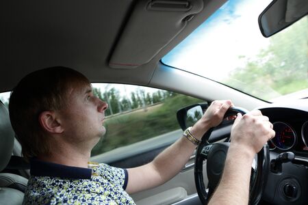Portrait of a man driving a car