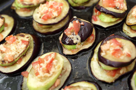 Baked eggplant on the black pan of ovenの写真素材