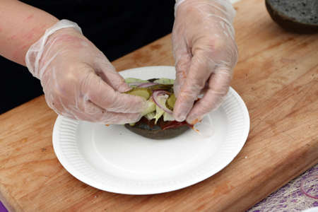 Chef preparation burgers in the outdoor restaurant
