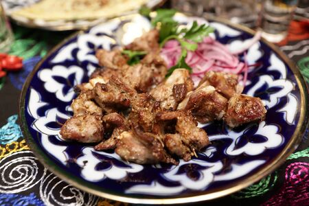 Grilled lamb ribs on a plate in the restaurantの写真素材